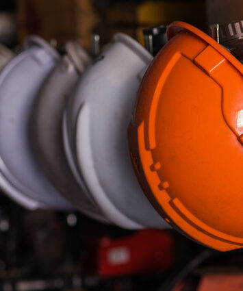 A close-up of a safety helmet worn by a worker, highlighting essential protective equipment for workplace safety.